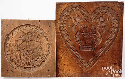 TWO CARVED CAKEBOARDS, THE LARGER