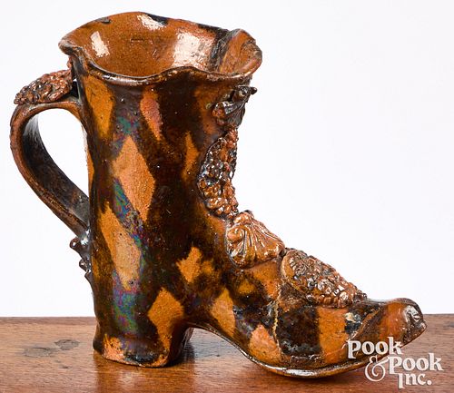 PENNSYLVANIA FIGURAL REDWARE BOOT,