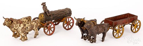 TWO HUBLEY CAST IRON OX DRAWN WAGONSTwo