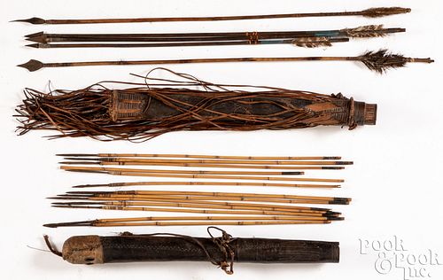 TWO AFRICAN HIDE QUIVERS WITH ARROWSTwo