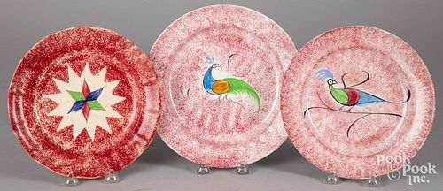 THREE RED SPATTER PLATES WITH PEAFOWL