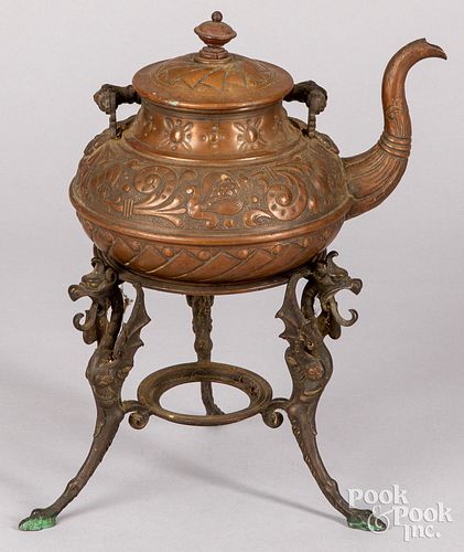 EMBOSSED COPPER TEA KETTLE ON A
