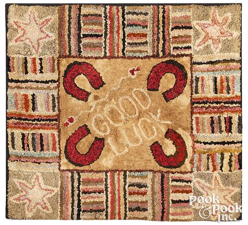 HOOKED RUG WITH HORSESHOES INSCRIBED
