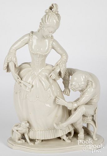 GLAZED BISQUE FIGURE OF A WOMAN