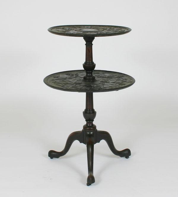Heavily carved two tier table  4e351