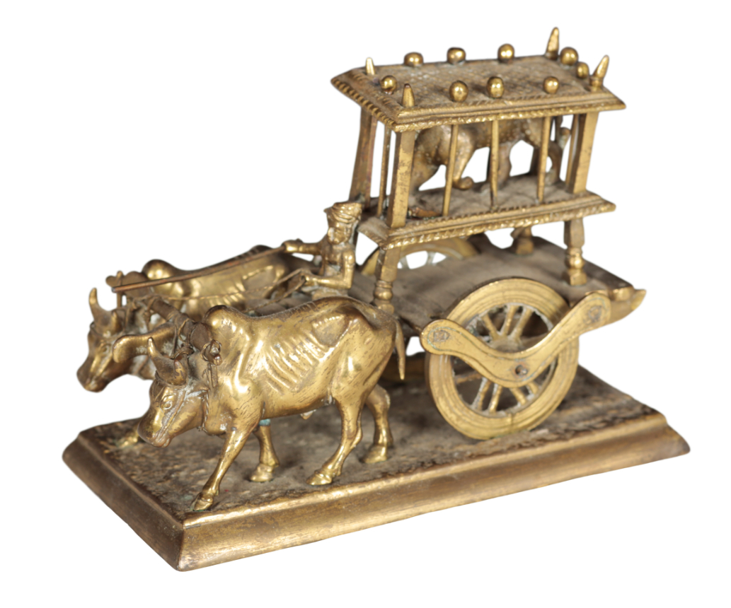 A BRASS MODEL OF OX PULLING A CART WITH
