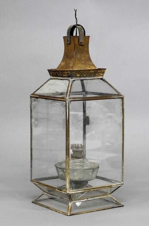 Tin and glass lantern with an oil 310e90