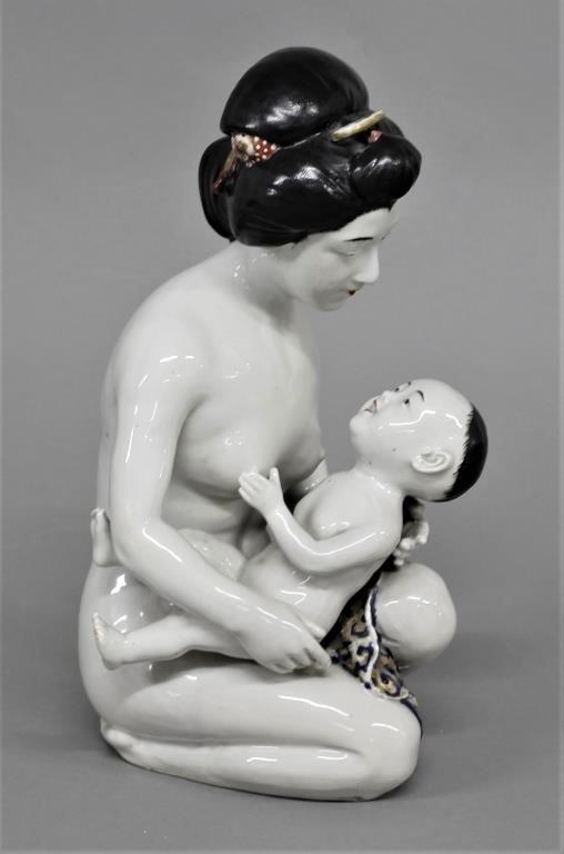 Asian porcelain figure of a mother