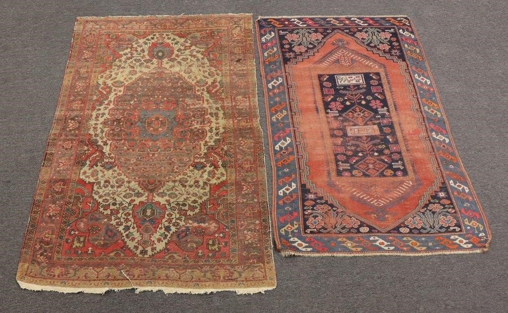 Two antique throw carpets, largest