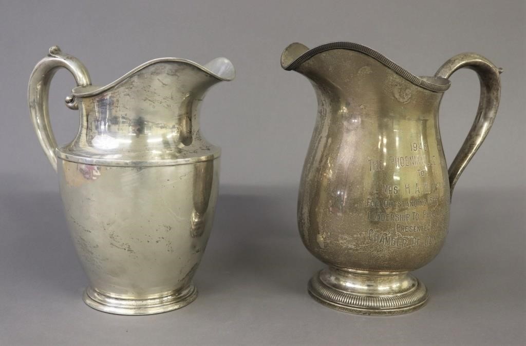 Two sterling silver water pitchers 31100d