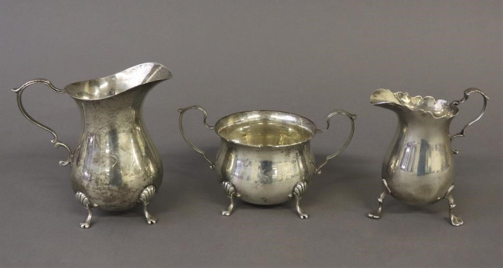 Two sterling silver creamers and 311024