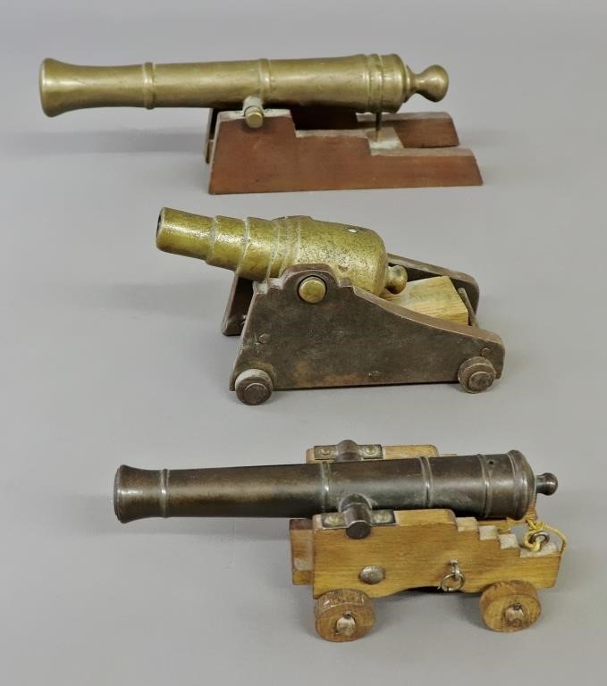 Two brass naval cannons, largest