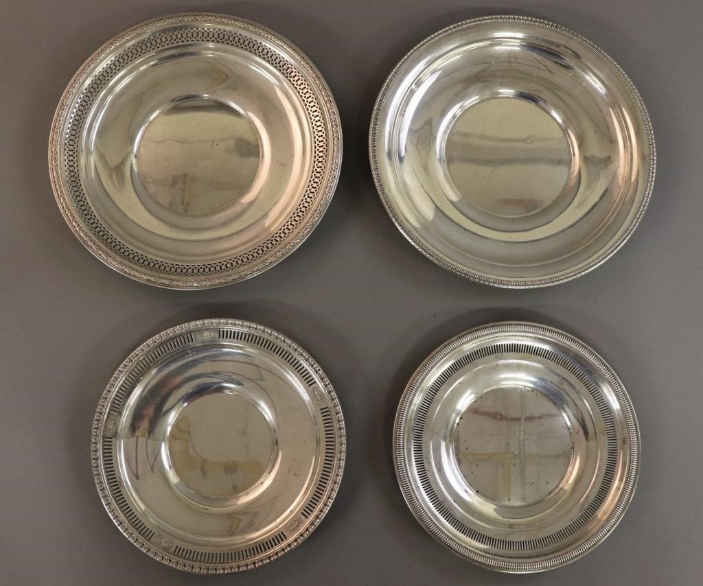 Four sterling silver plates, largest