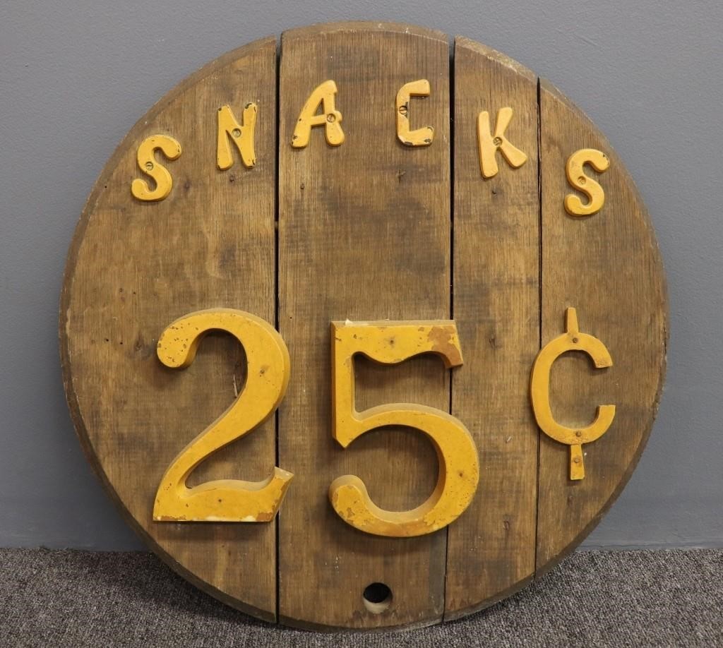 Metal and round wood sign Snacks 25¢,
