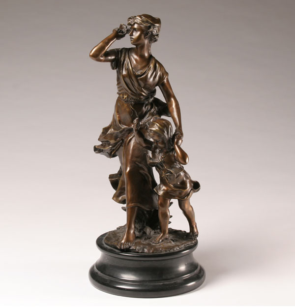 Bronze figure of a mother with