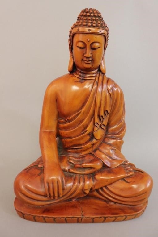 A Buddha seated in the lotus position,
