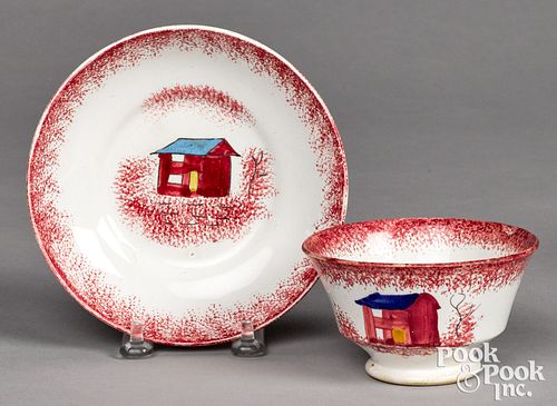 RED SPATTER SHED CUP AND SAUCER.Red