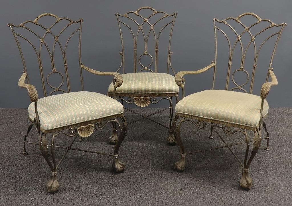 Five wrought iron patio chairs