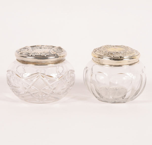 Two glass powder jars with sterling