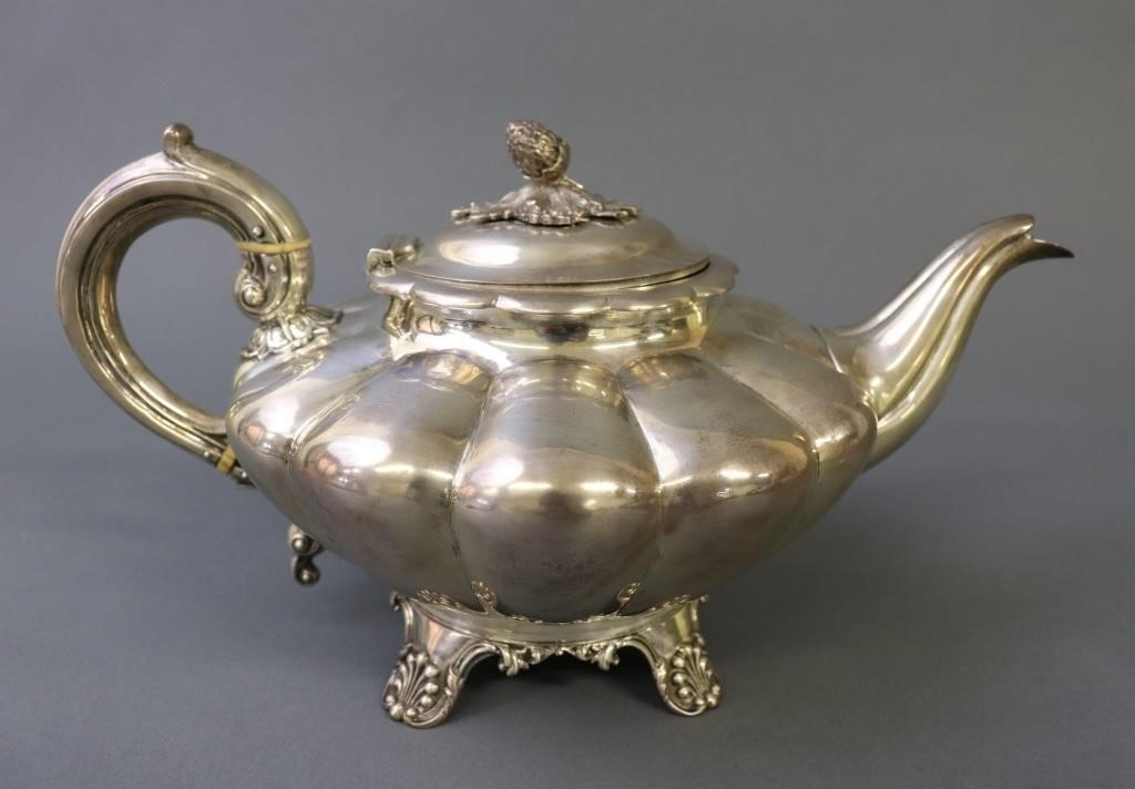 English silver lobed teapot with strawberry