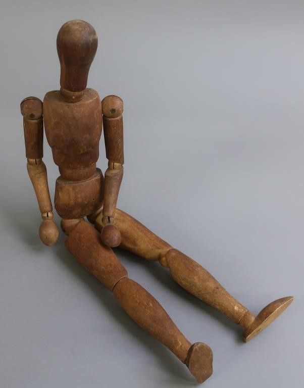 Articulated wooden male figure artist