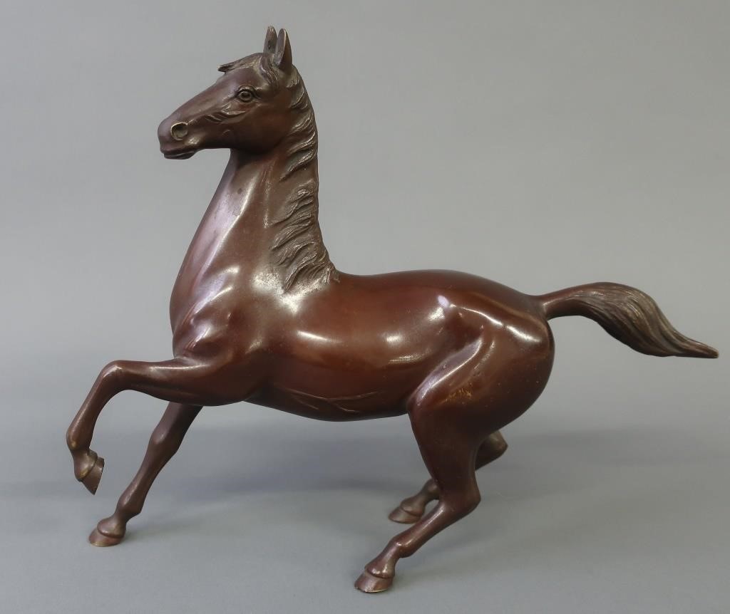 Asian bronze of a prancing stallion,