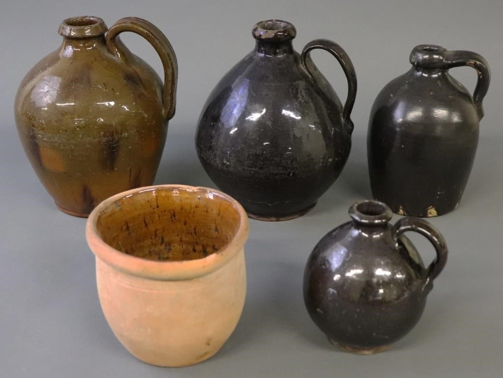 Four redware jugs, 19th c., tallest