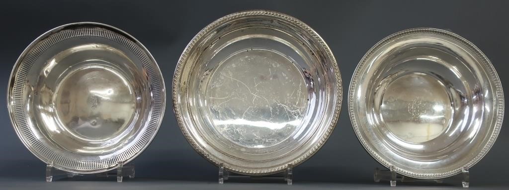 Three sterling silver dishes, largest