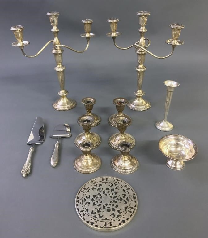 Pair of weighted sterling silver candelabra,