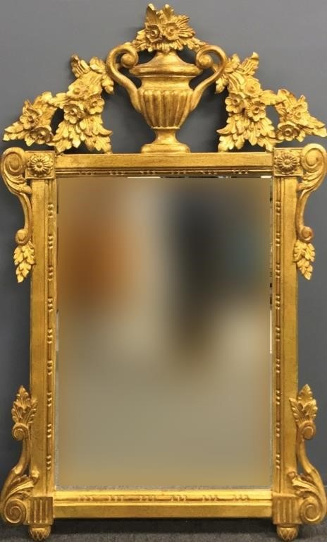 Gilt mirror decorated with urn and floral