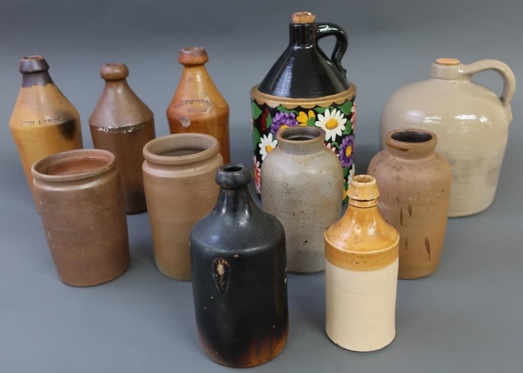 Eleven stoneware and redware jugs,