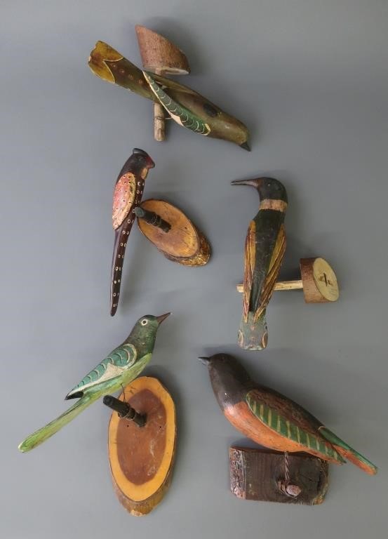 Five carved and painted birds,