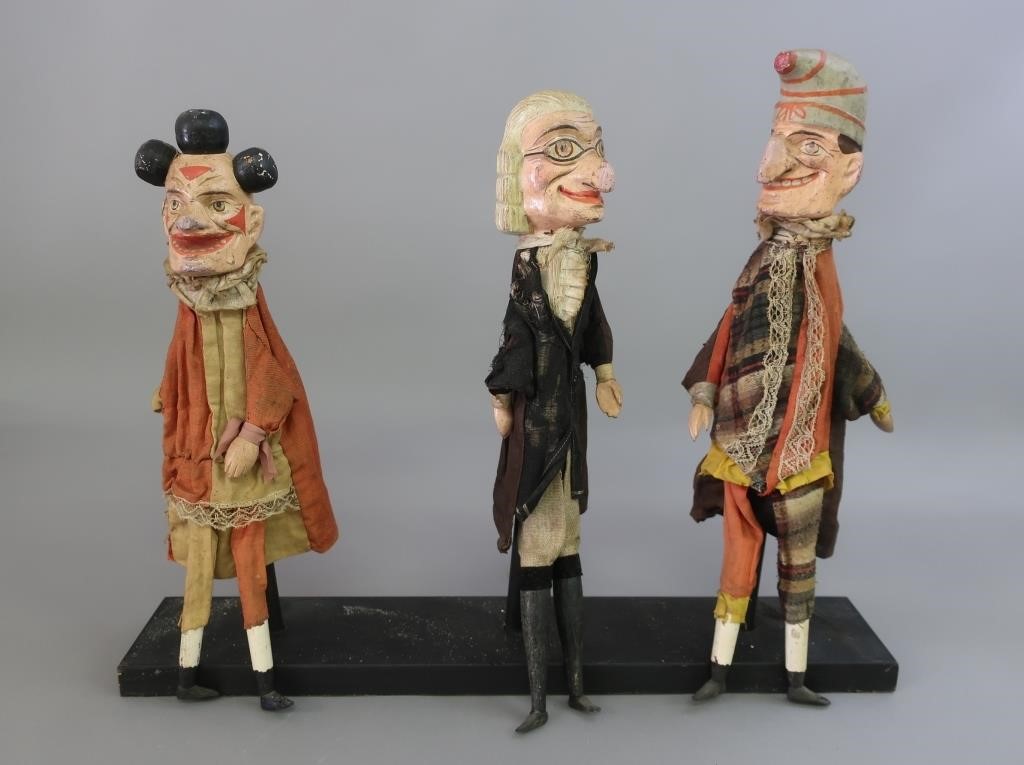 Three carved and painted character figures,