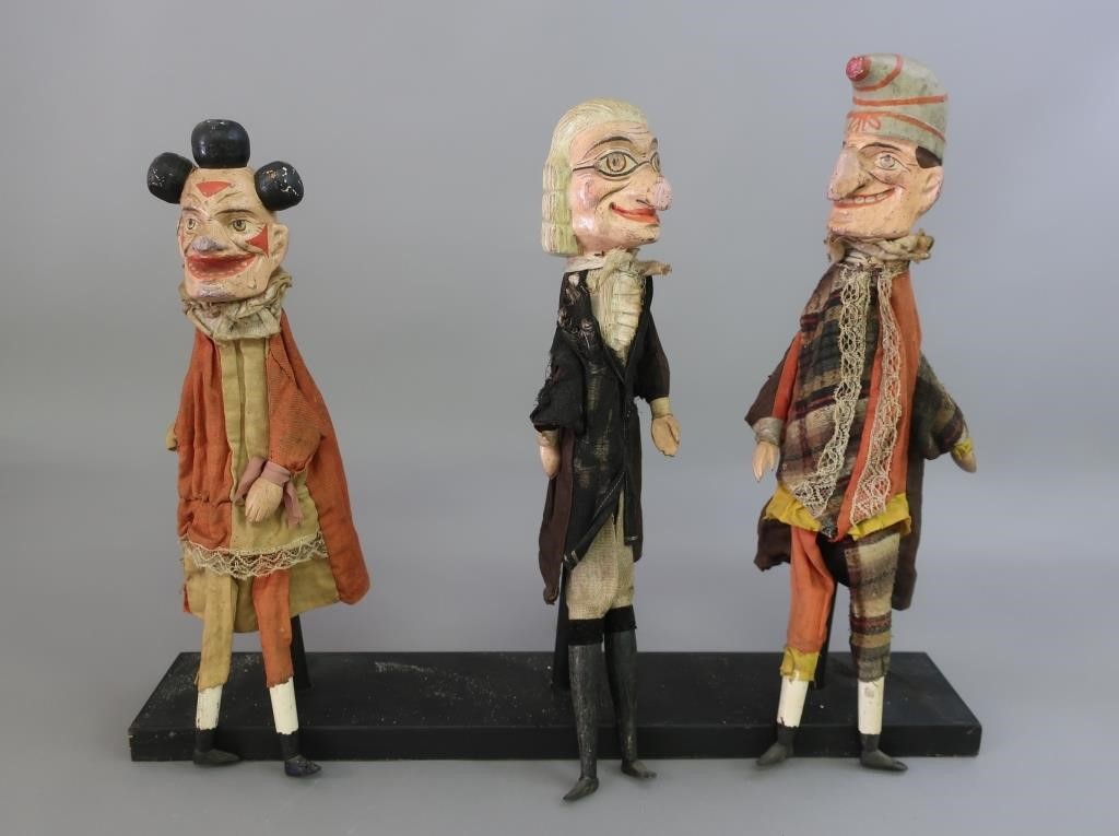 Three carved and painted character