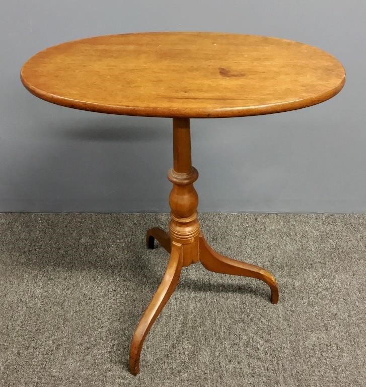 Oval tilt-top candlestand, circa 1820,