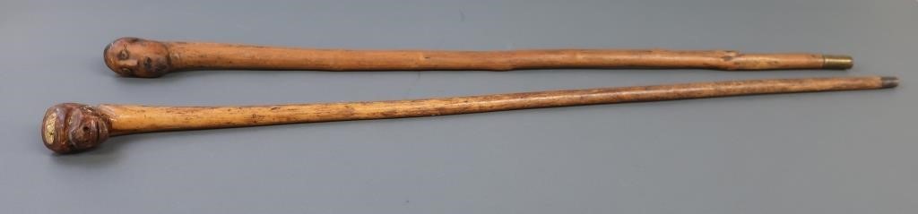 Two Folk Art canes with carved 311c62