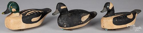 THREE CARVED AND PAINTED DUCK DECOYSThree