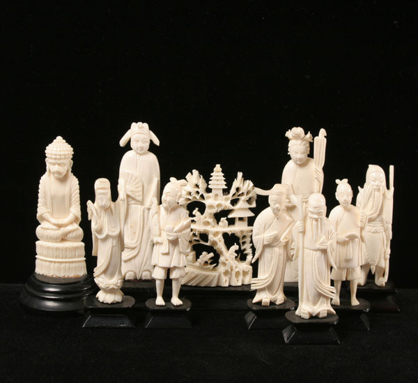 Carved elephant ivory figures; six smaller