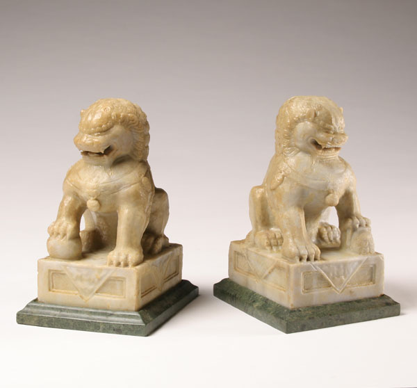 Pair of carved white soapstone foo dogs;