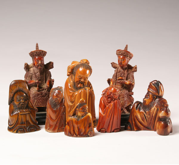 Eight carved signed oriental figures  4e989