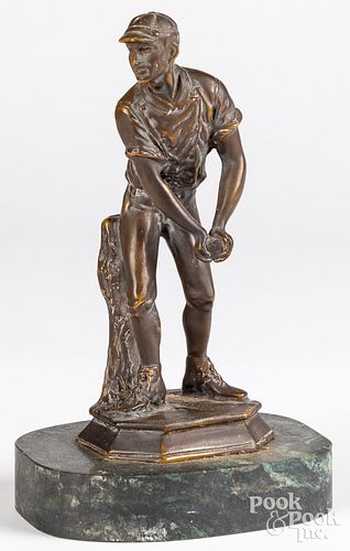 BRONZE FIGURE OF A WORKING MANBronze