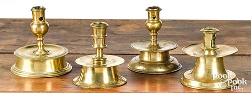 FOUR BRASS CAPSTAN CANDLESTICKS,