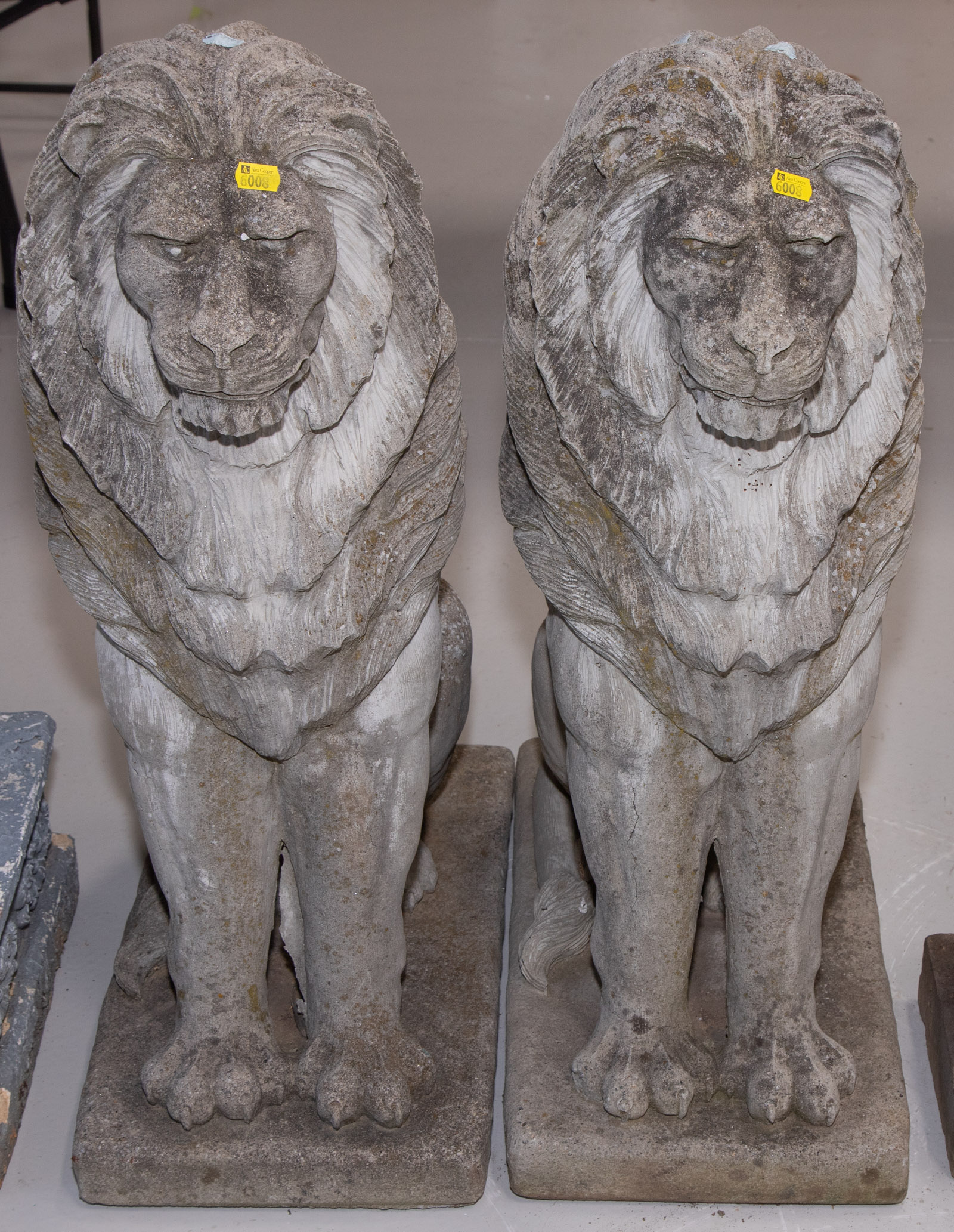 A PAIR OF CEMENT LION GARDEN FIGURES