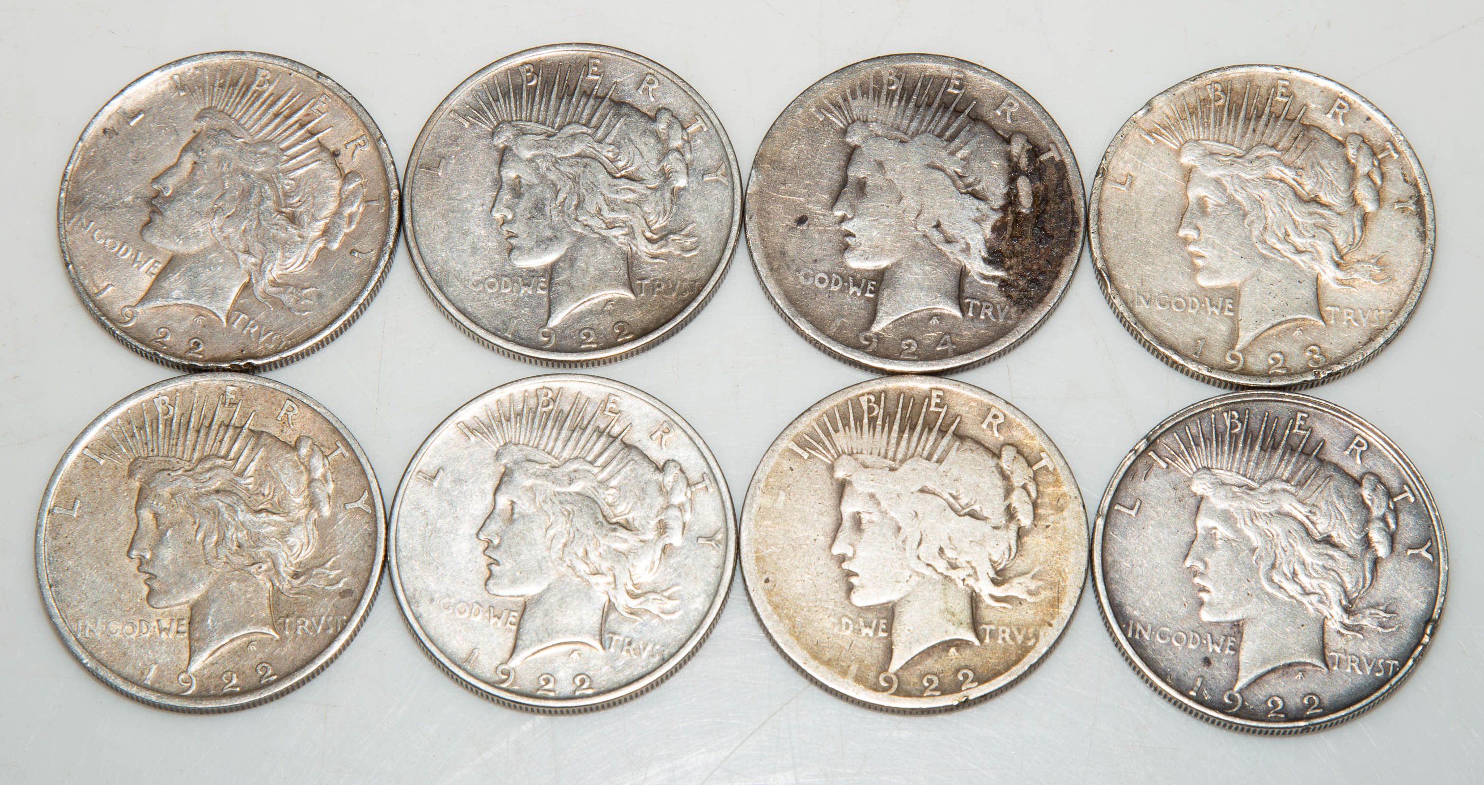 EIGHT SILVER PEACE DOLLARS 4-1922 F,