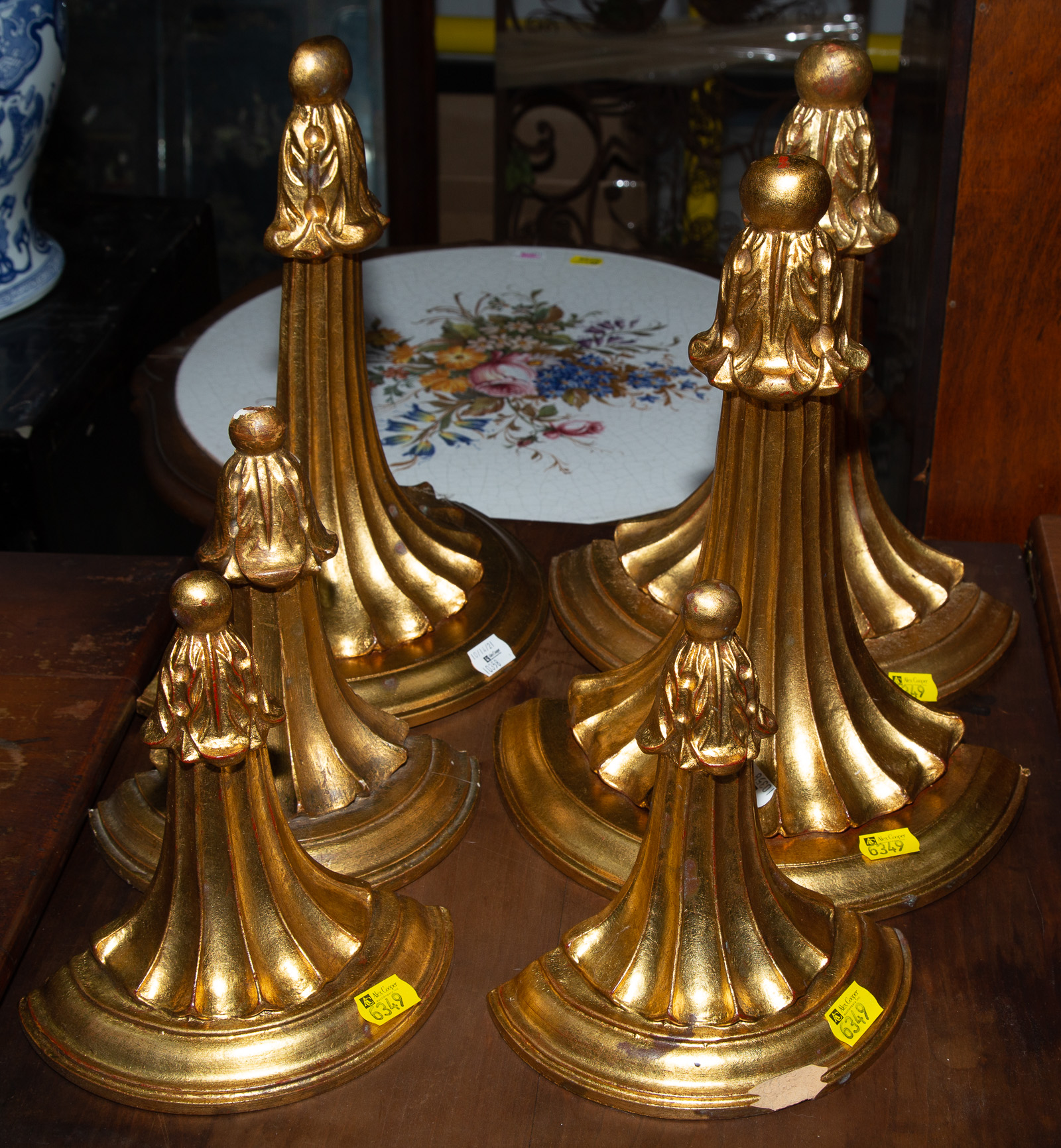 SIX GILT COMPOSITION WALL SHELVES .