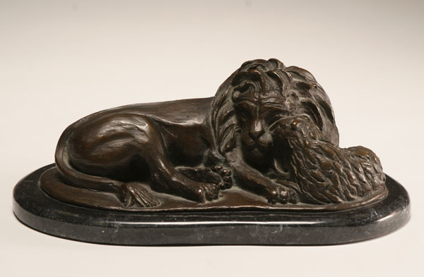 Lion and lamb bronze group on marble