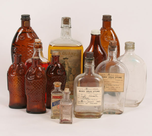 Thirteen bottles including Old Quaker