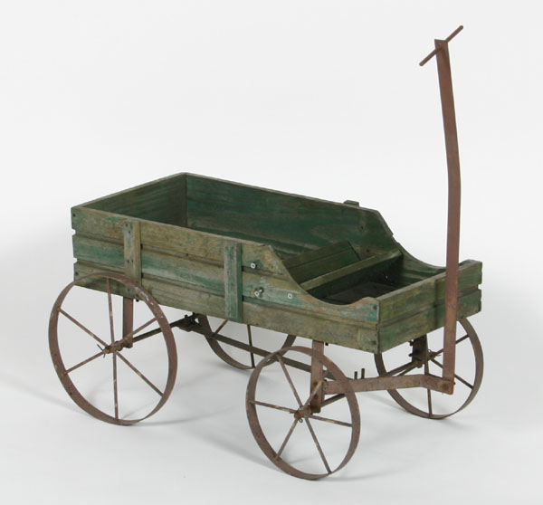 Primitive childs wagon with iron wheels,
