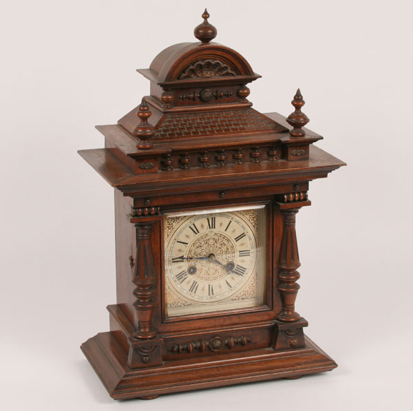 Extensively carved mantle clock with