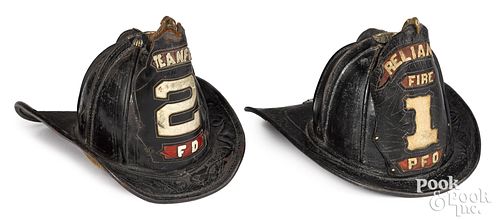 TWO PAINTED LEATHER FIRE HELMETS, 19TH